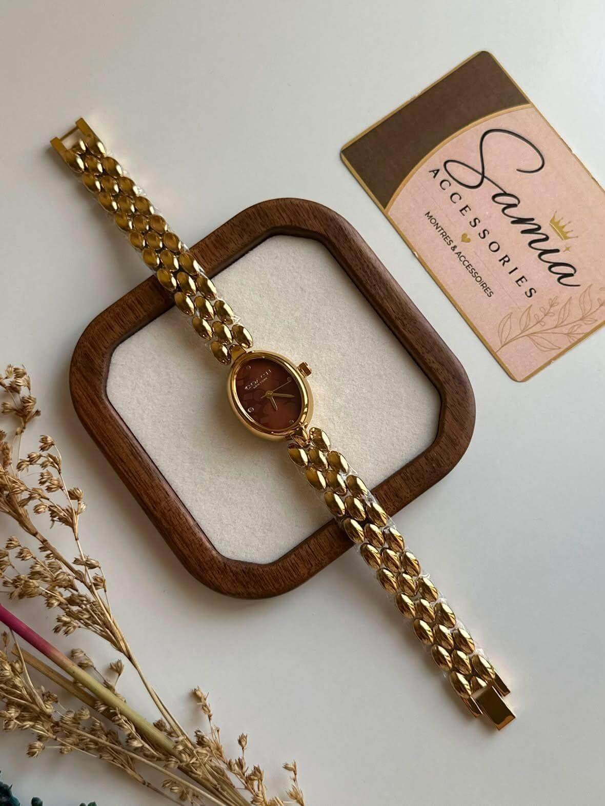 Montre Coach en acier doré